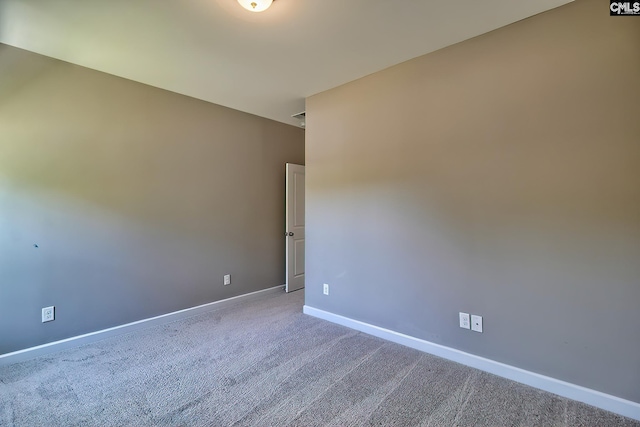 spare room featuring carpet flooring