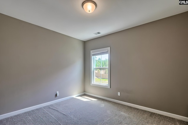 unfurnished room with carpet flooring