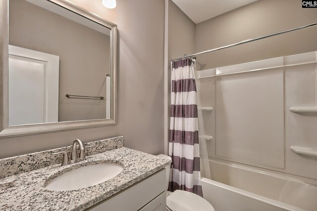 full bathroom featuring vanity, toilet, and shower / tub combo