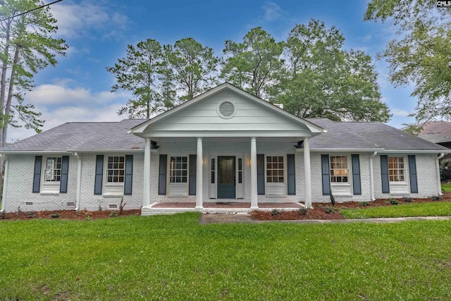 view of front of home with a front yard and covered porch