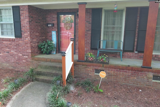 doorway to property featuring a porch