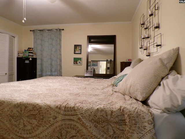 bedroom featuring ornamental molding and a closet