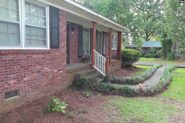 exterior space with a lawn and a porch