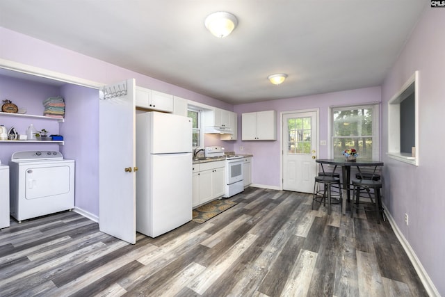 kitchen featuring white cabinetry, sink, white appliances, and dark hardwood / wood-style flooring