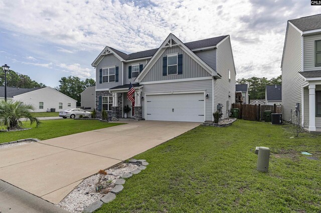 craftsman house with a garage and a front yard