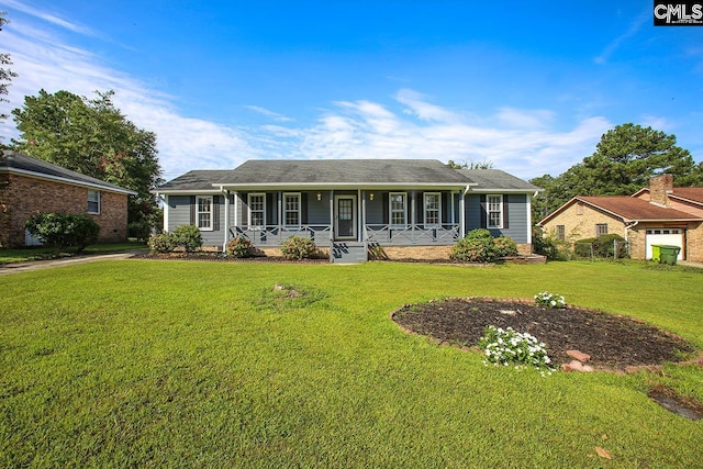 single story home with covered porch and a front yard