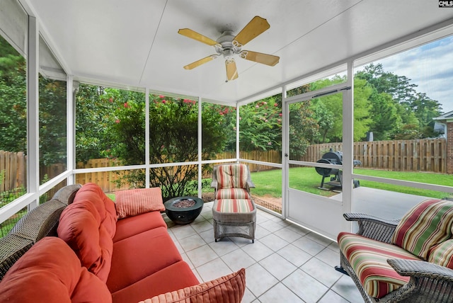 sunroom / solarium featuring ceiling fan