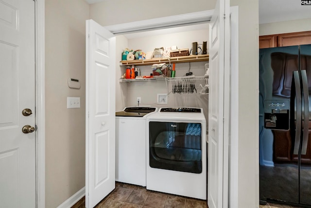 laundry area with tile patterned floors and washing machine and clothes dryer