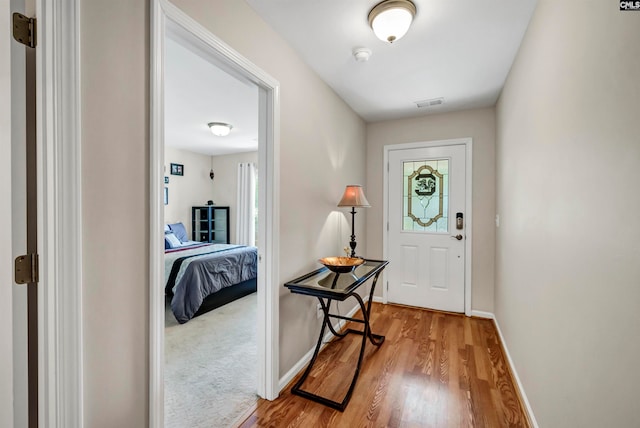 foyer entrance with light carpet