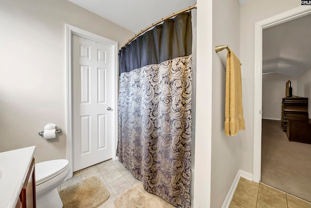 bathroom featuring vanity, toilet, and tile patterned floors