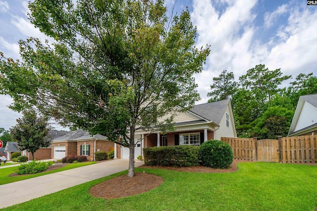 view of front of house with a garage and a front lawn