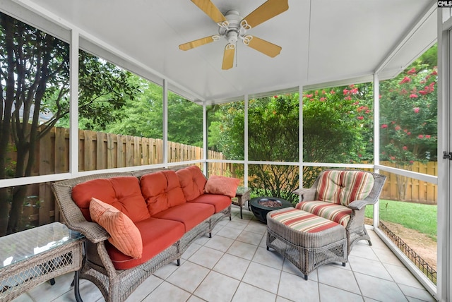 sunroom / solarium featuring ceiling fan