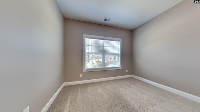 spare room featuring carpet floors