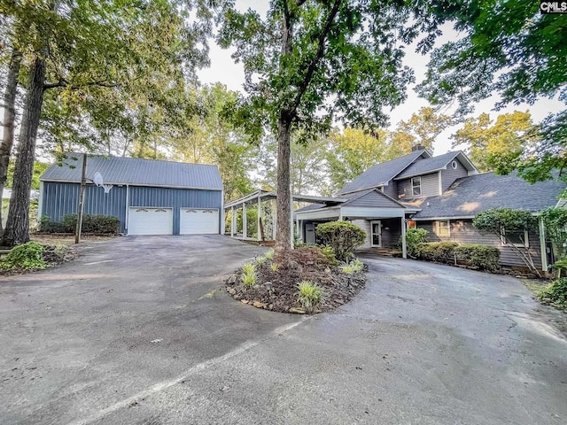 view of side of property with a garage