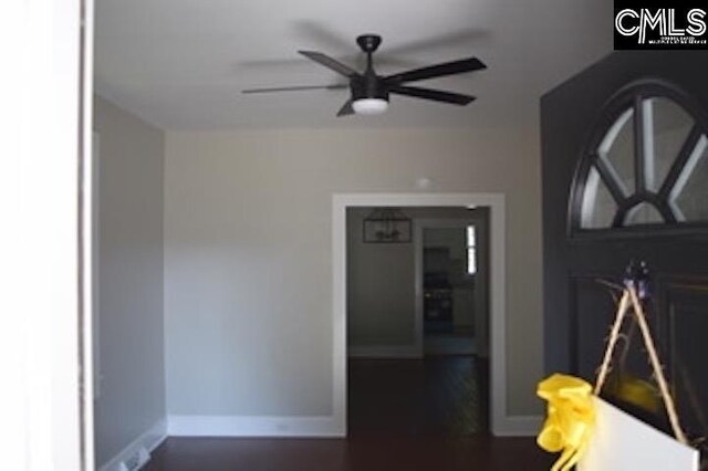 unfurnished bedroom featuring connected bathroom, ceiling fan, a barn door, and carpet floors