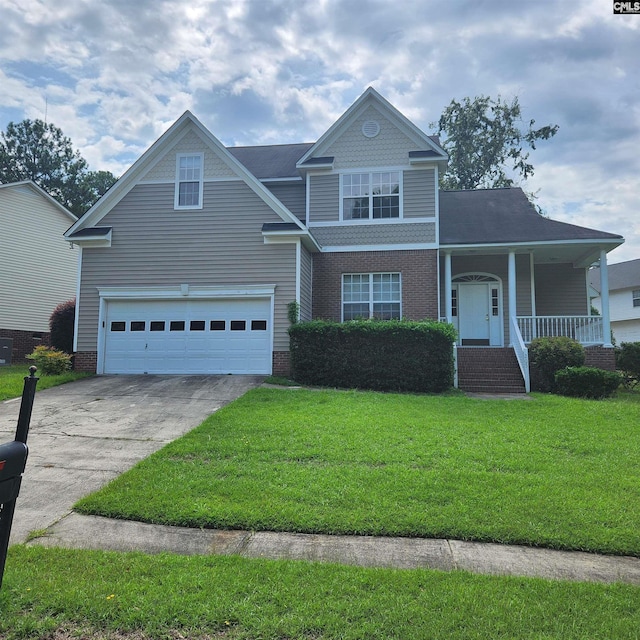 front of property featuring a garage, a front yard, and covered porch