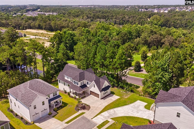 aerial view featuring a wooded view