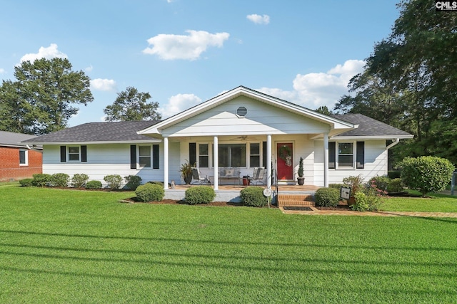 single story home featuring ceiling fan, roof with shingles, a porch, and a front lawn