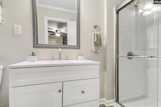 full bath with toilet, a shower stall, ornamental molding, and vanity