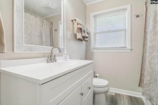 full bathroom with baseboards, visible vents, toilet, wood finished floors, and vanity