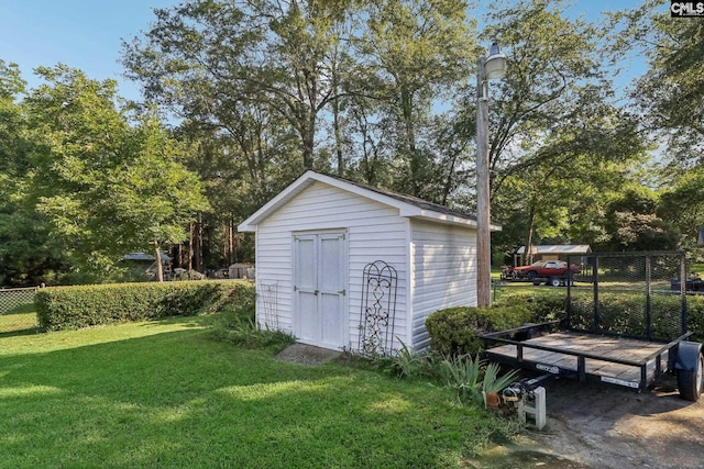 view of shed with fence