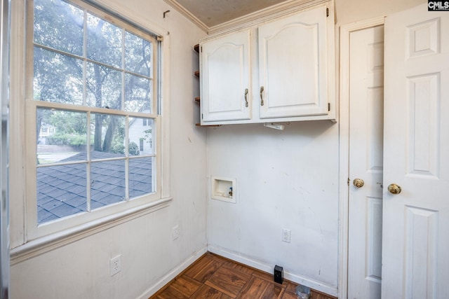 laundry room featuring cabinets, dark parquet flooring, plenty of natural light, and washer hookup