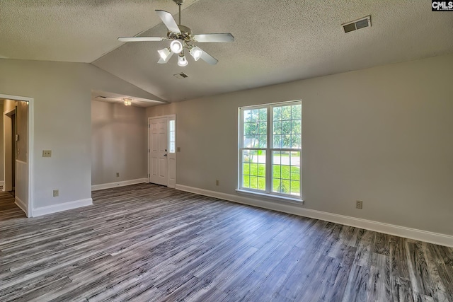 empty room with hardwood / wood-style floors, lofted ceiling, a textured ceiling, and ceiling fan