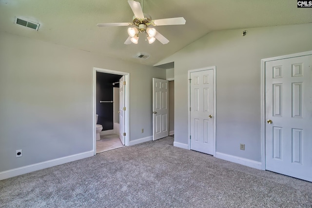 unfurnished bedroom with light carpet, lofted ceiling, connected bathroom, and ceiling fan