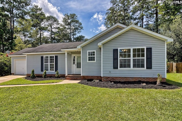 single story home featuring a front yard and a garage