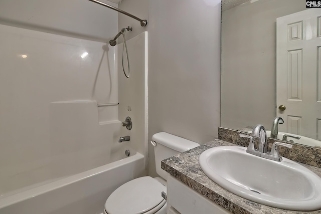 full bathroom featuring toilet, shower / bathing tub combination, and vanity