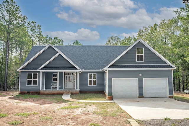 craftsman-style home with covered porch and a garage