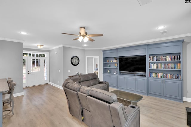 living room with light hardwood / wood-style flooring, ornamental molding, and ceiling fan