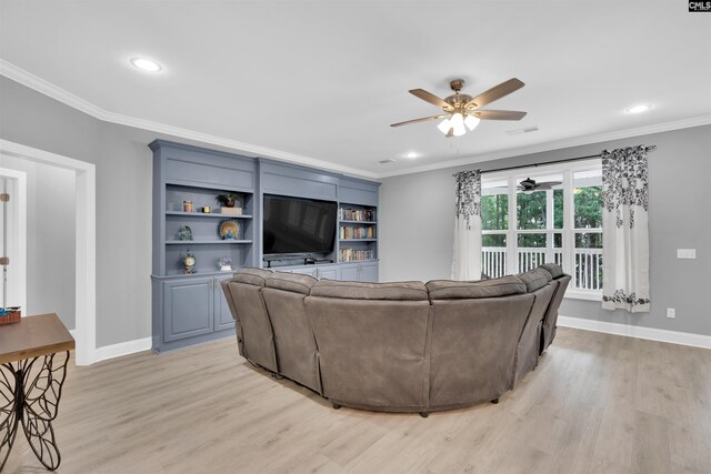 living room featuring built in shelves, ornamental molding, ceiling fan, and light hardwood / wood-style floors