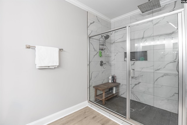 bathroom with hardwood / wood-style floors, crown molding, and an enclosed shower