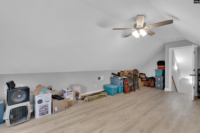 additional living space with ceiling fan, light hardwood / wood-style flooring, and vaulted ceiling