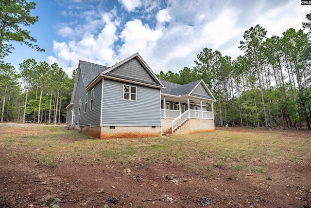 view of property exterior with covered porch