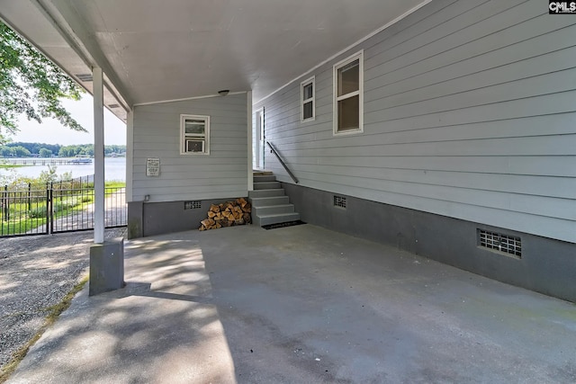 view of patio featuring a water view