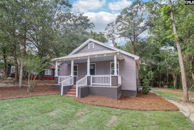 bungalow-style home with a porch and a front yard