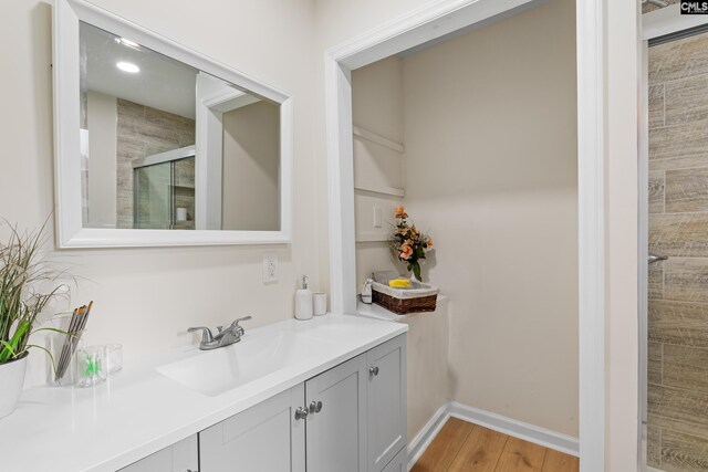 bathroom with vanity and hardwood / wood-style floors