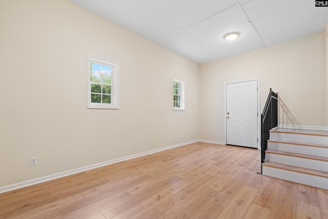 foyer entrance with light hardwood / wood-style floors