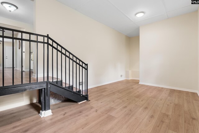 stairway with hardwood / wood-style flooring