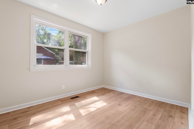 empty room with light wood-type flooring