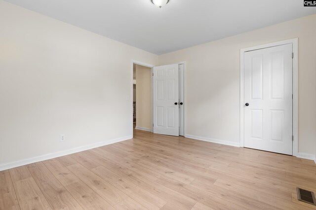 unfurnished bedroom with light hardwood / wood-style floors