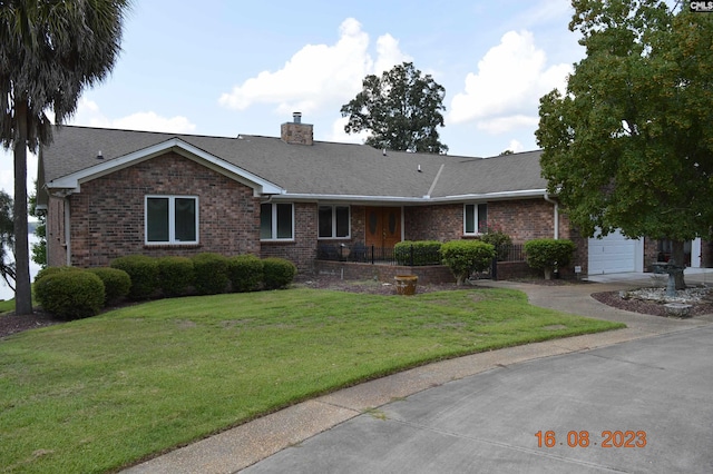 ranch-style house with a garage and a front yard