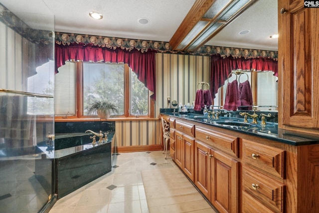 full bath with wallpapered walls, baseboards, a garden tub, tile patterned flooring, and vanity