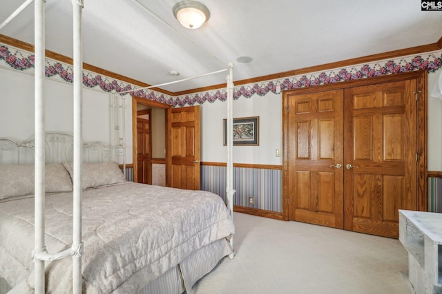 bedroom with light carpet and ornamental molding