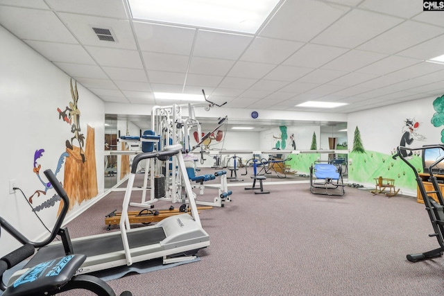 workout area with visible vents and a drop ceiling