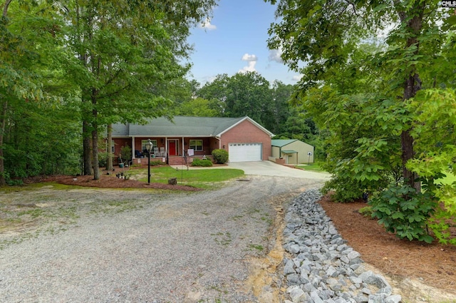 ranch-style home with brick siding, concrete driveway, a porch, and an attached garage
