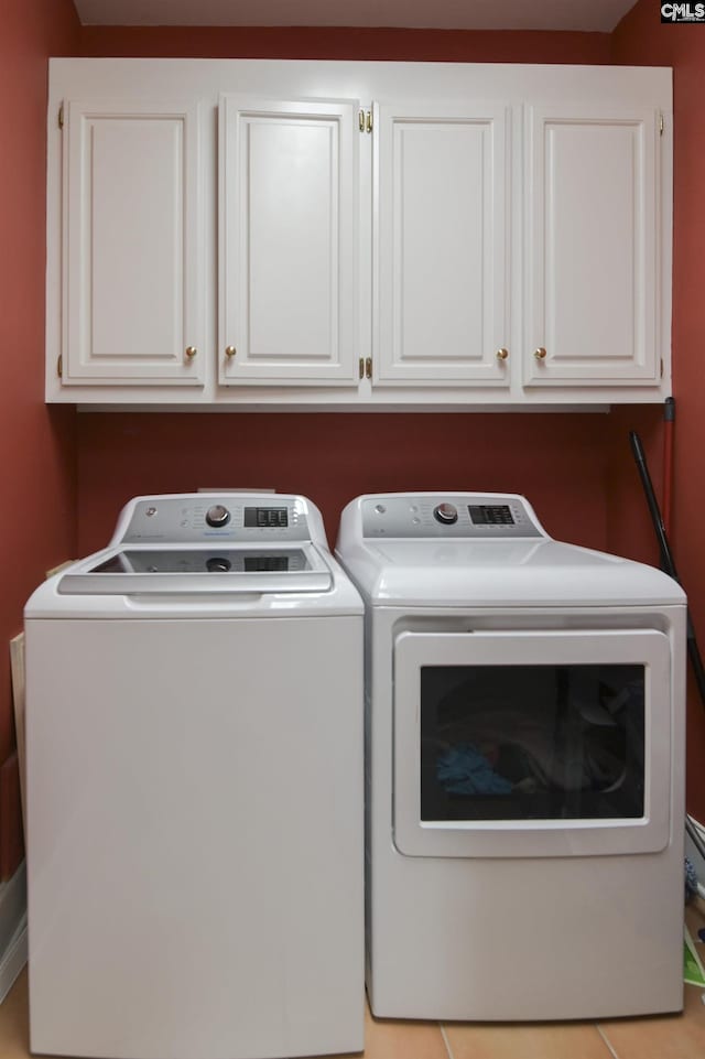 laundry area with cabinet space and washing machine and clothes dryer