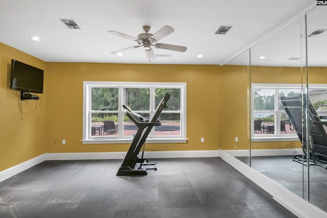 exercise area featuring a healthy amount of sunlight, recessed lighting, and baseboards